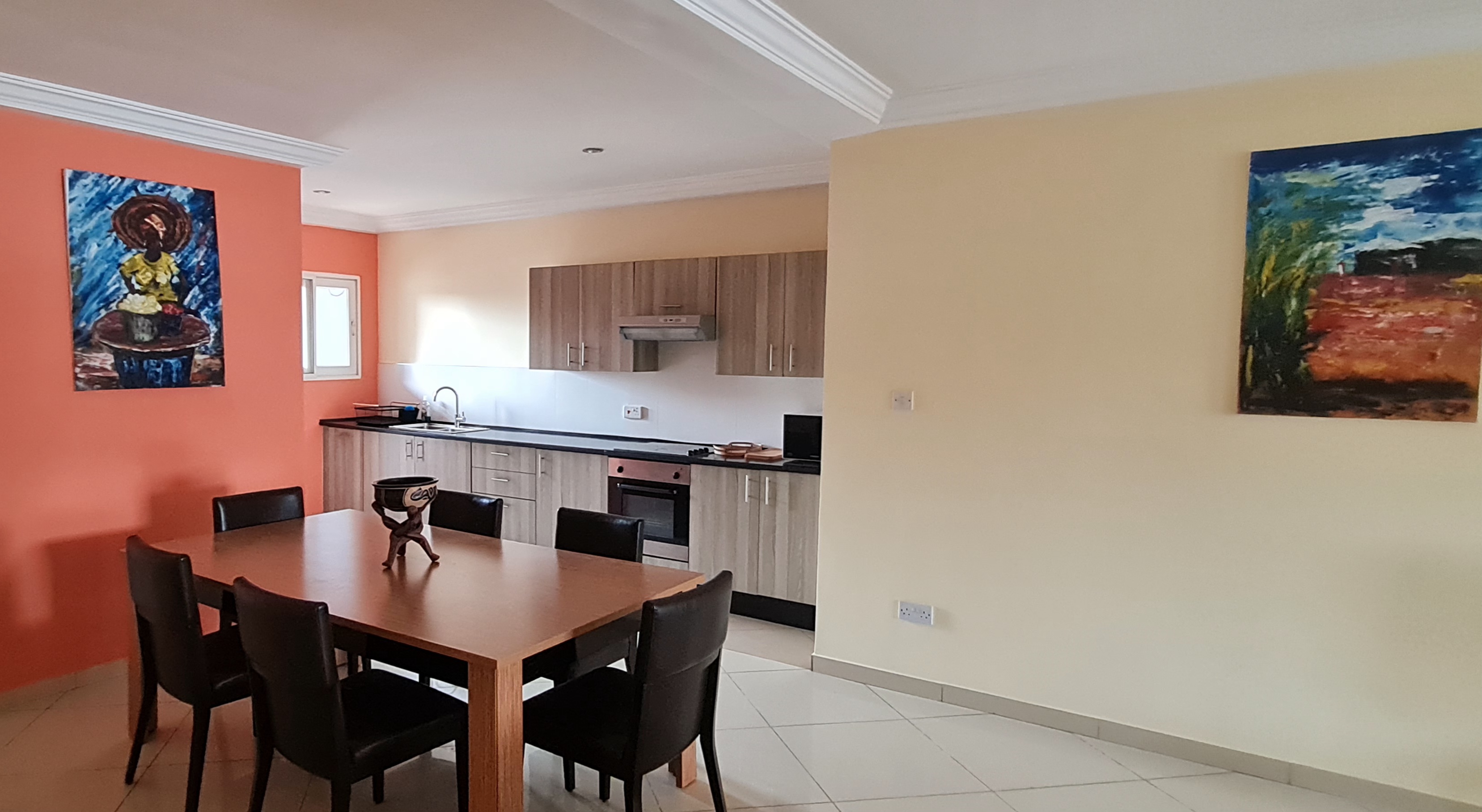 Dining area and kitchen at Mamle's Retreat in East Legon, Accra